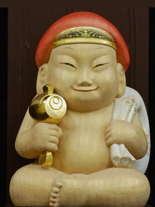 Biriken status and Shichi-Fuku-Jin(Seven Lucky Gods) statues at Tsūtenkaku, Osaka