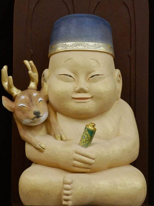 Biriken status and Shichi-Fuku-Jin(Seven Lucky Gods) statues at Tsūtenkaku, Osaka